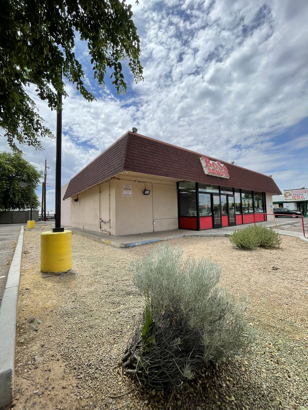 Phoenix commercial storefront before work, with faded paint and weathered trim