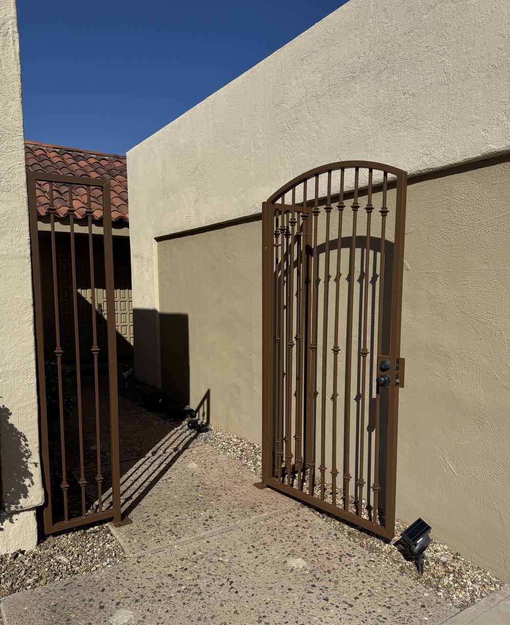 Phoenix wrought iron gate refinished in an even bronze enamel